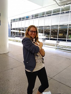Smallest little female puppy named Ginger meets her new mommy at Columbus airport